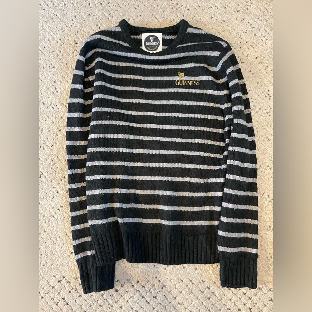 Size medium Guinness Brand pullover from Dublin Airport in gray and black stripe